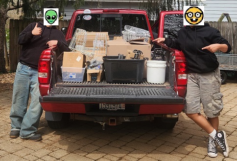 Truckload of parts in boxes, with my helpers